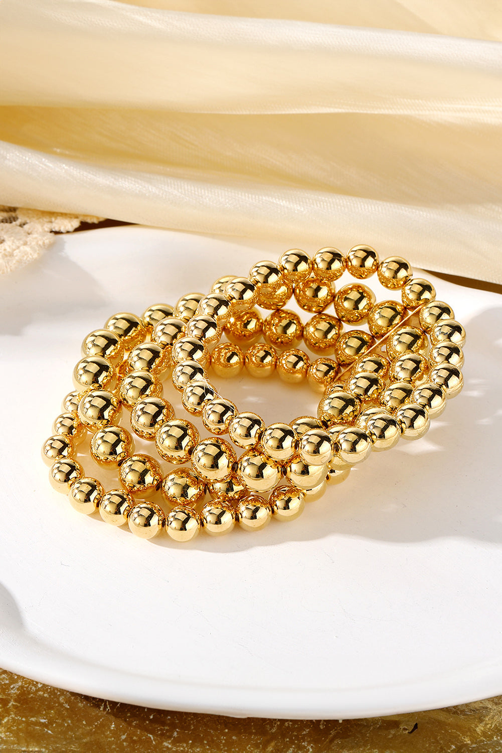 Gold Multi Layered Alloy Beaded Elastic Bracelet